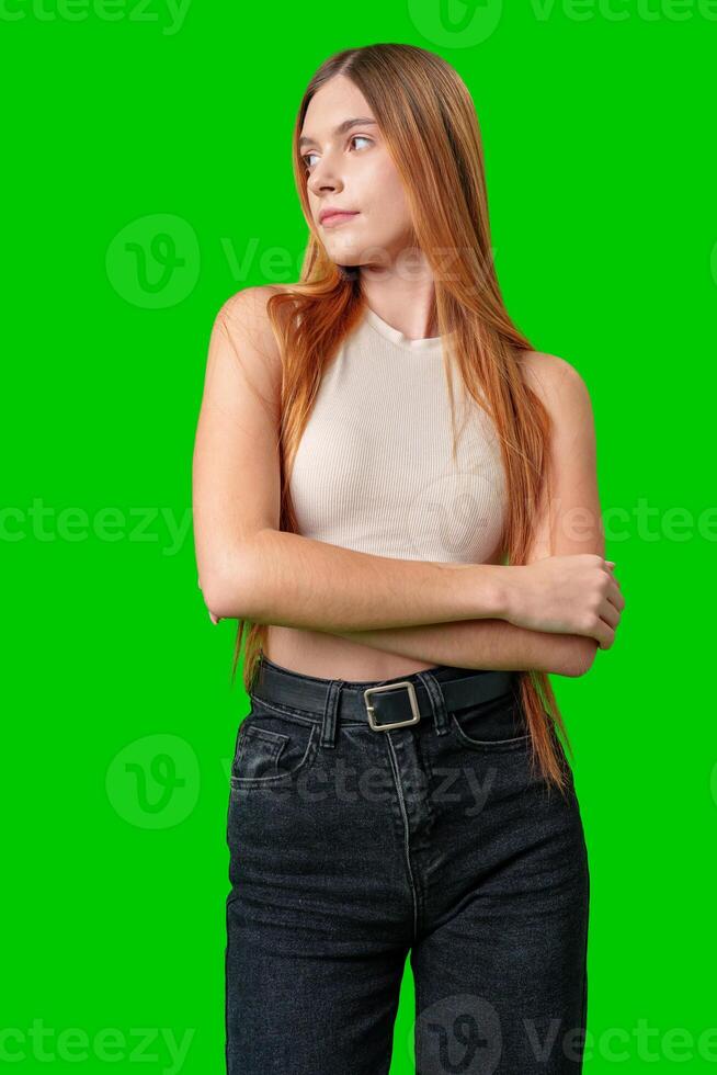Young Woman With Long Hair Posing Against Green Screen Background photo