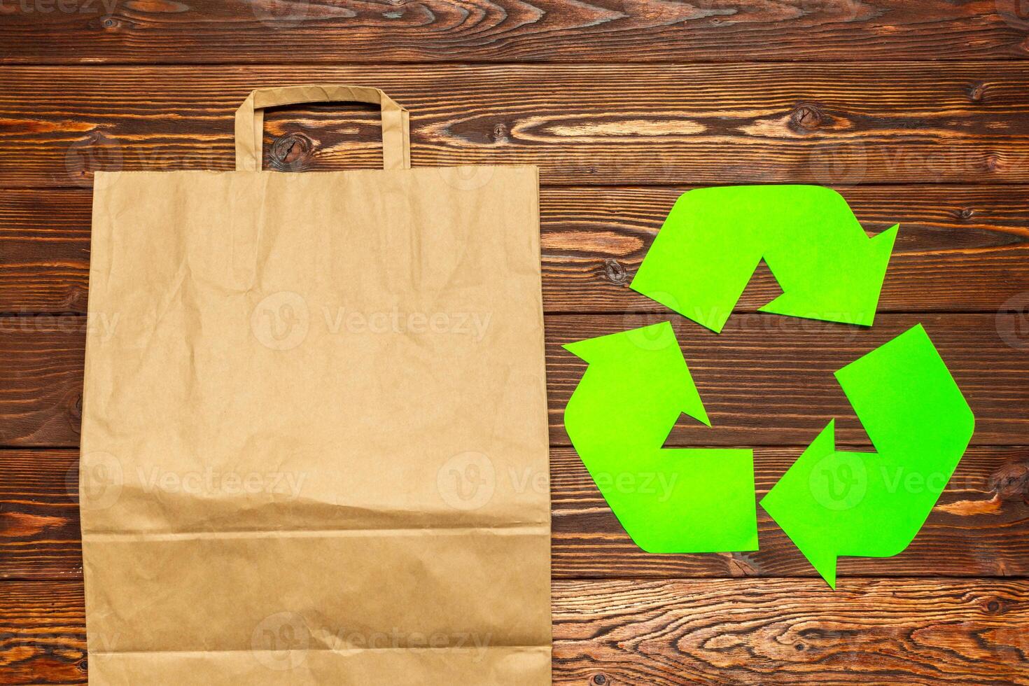 Eco concept with recycling symbol on table background top view photo