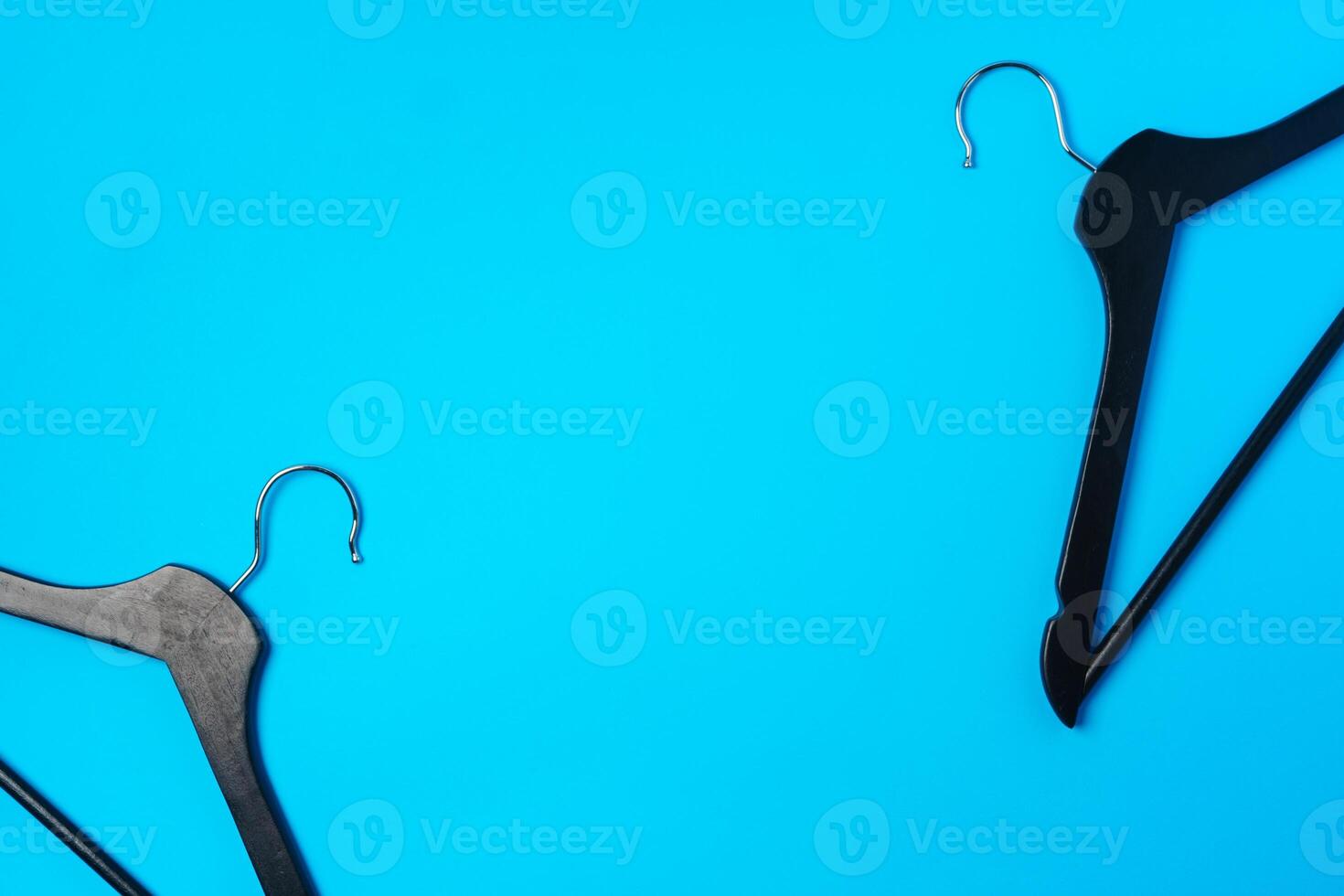 Blue hanger on trendy blue color background. Template fashion blog social media. photo
