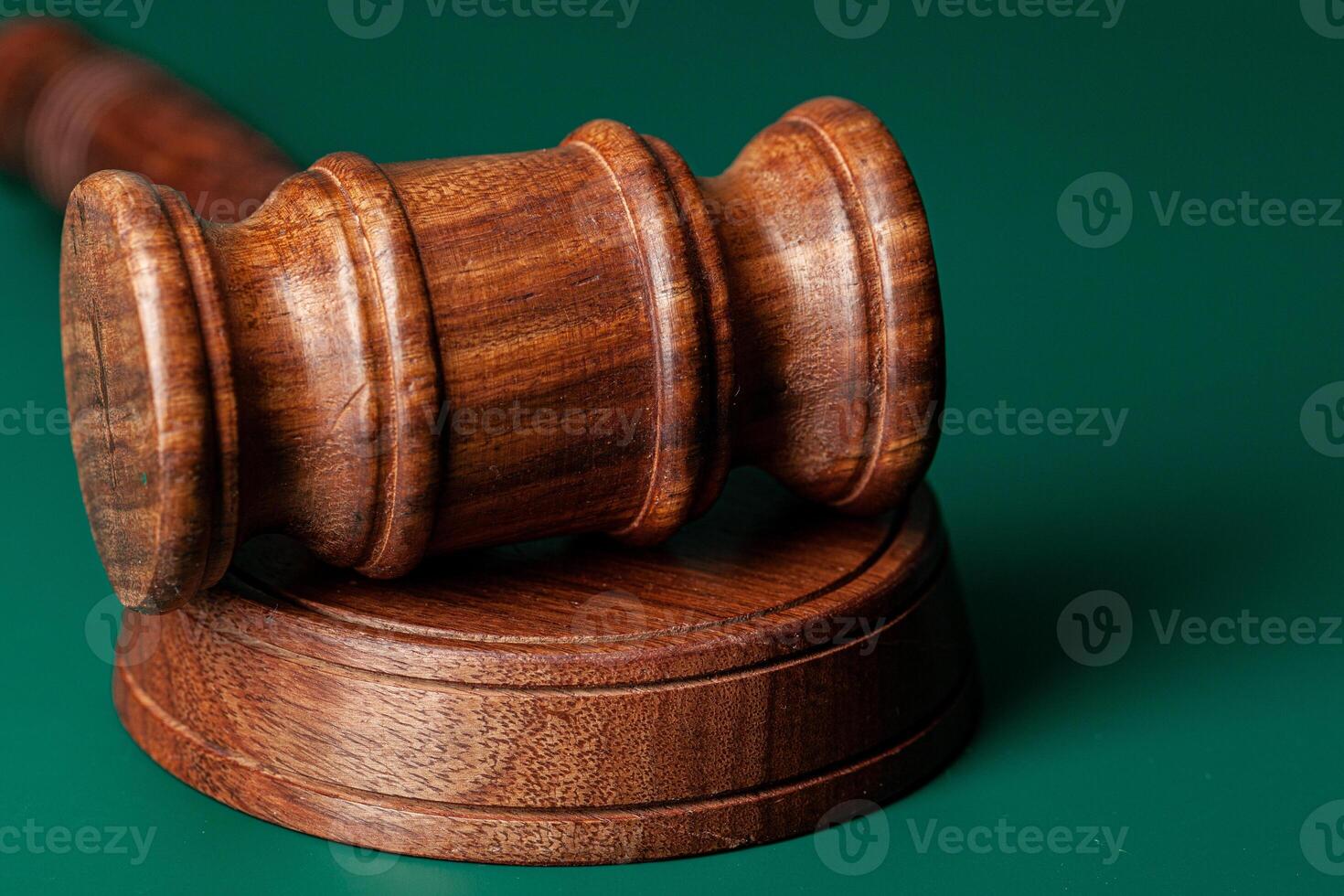 Wooden judges gavel on table close up photo