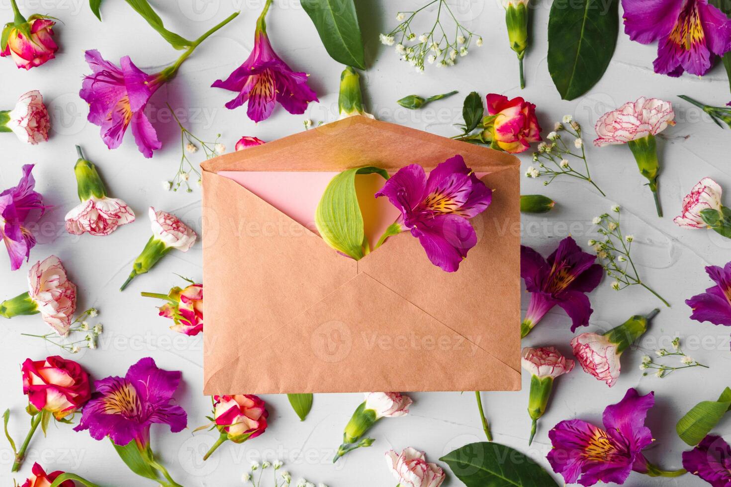Craft paper envelope with bunch of flowers photo