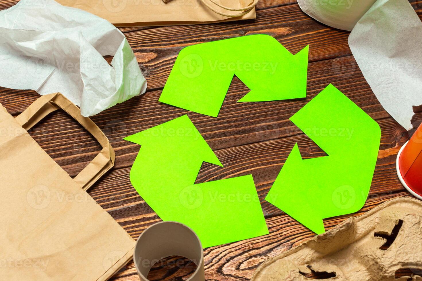 Eco concept with recycling symbol on table background top view photo
