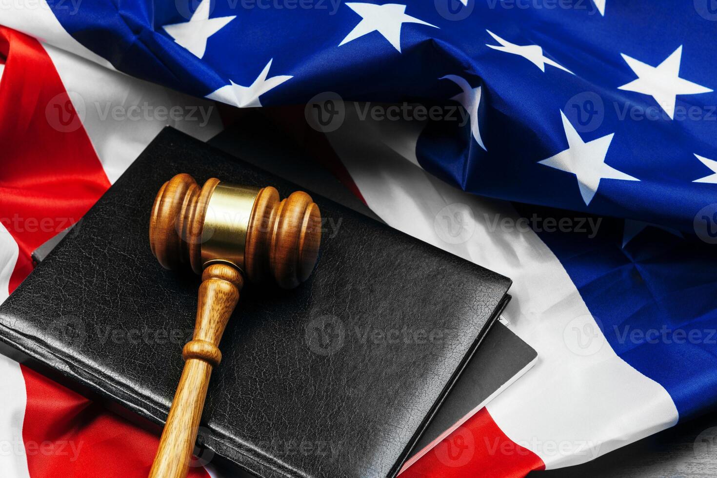 Gavel on wooden table with USA flag photo