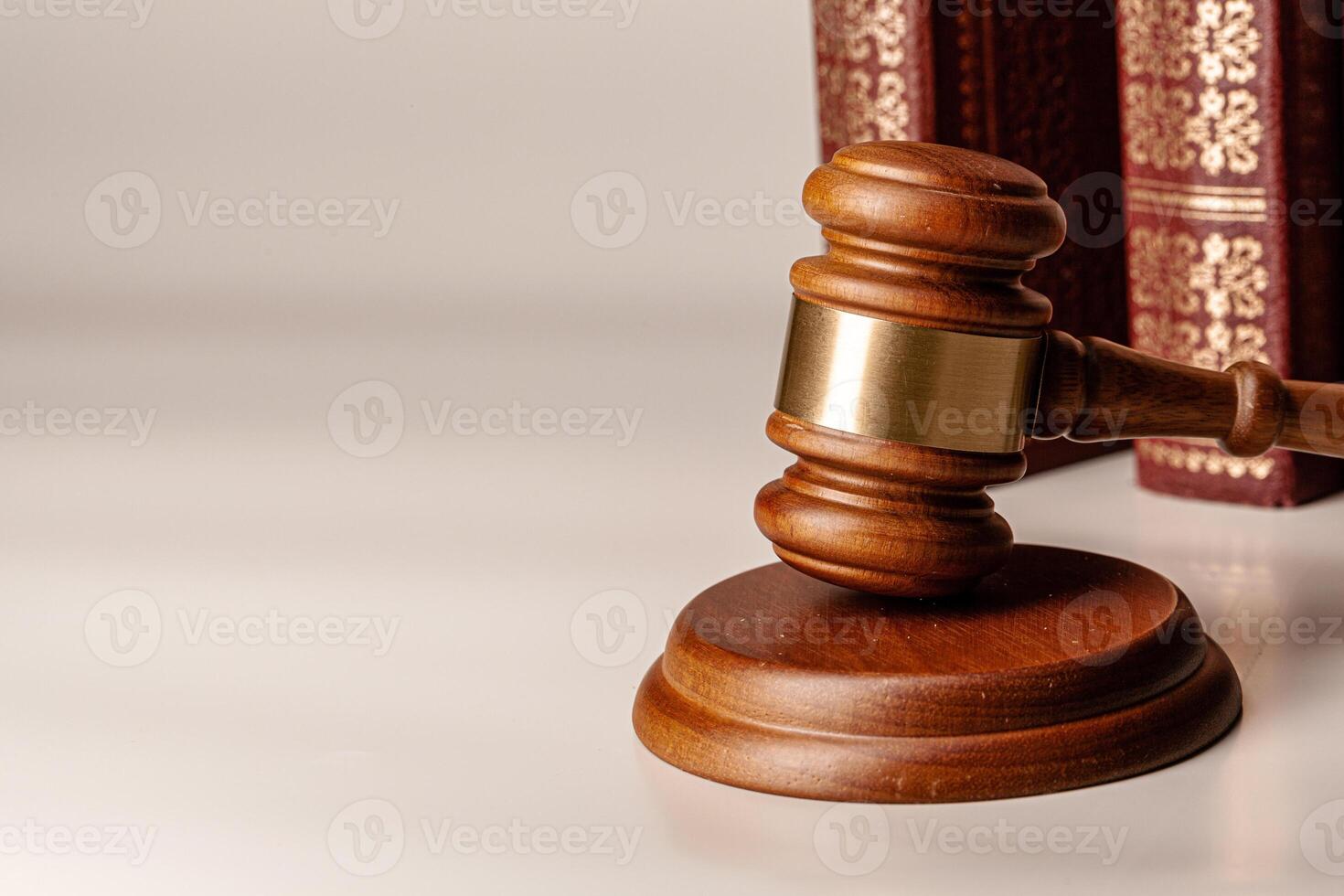 Judge gavel and legal book close up on table photo