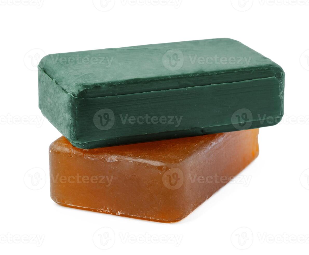 Beige and green soap bars on white background photo