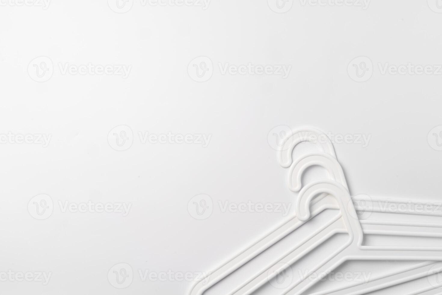 a pile clothes hangers on isolated white background photo