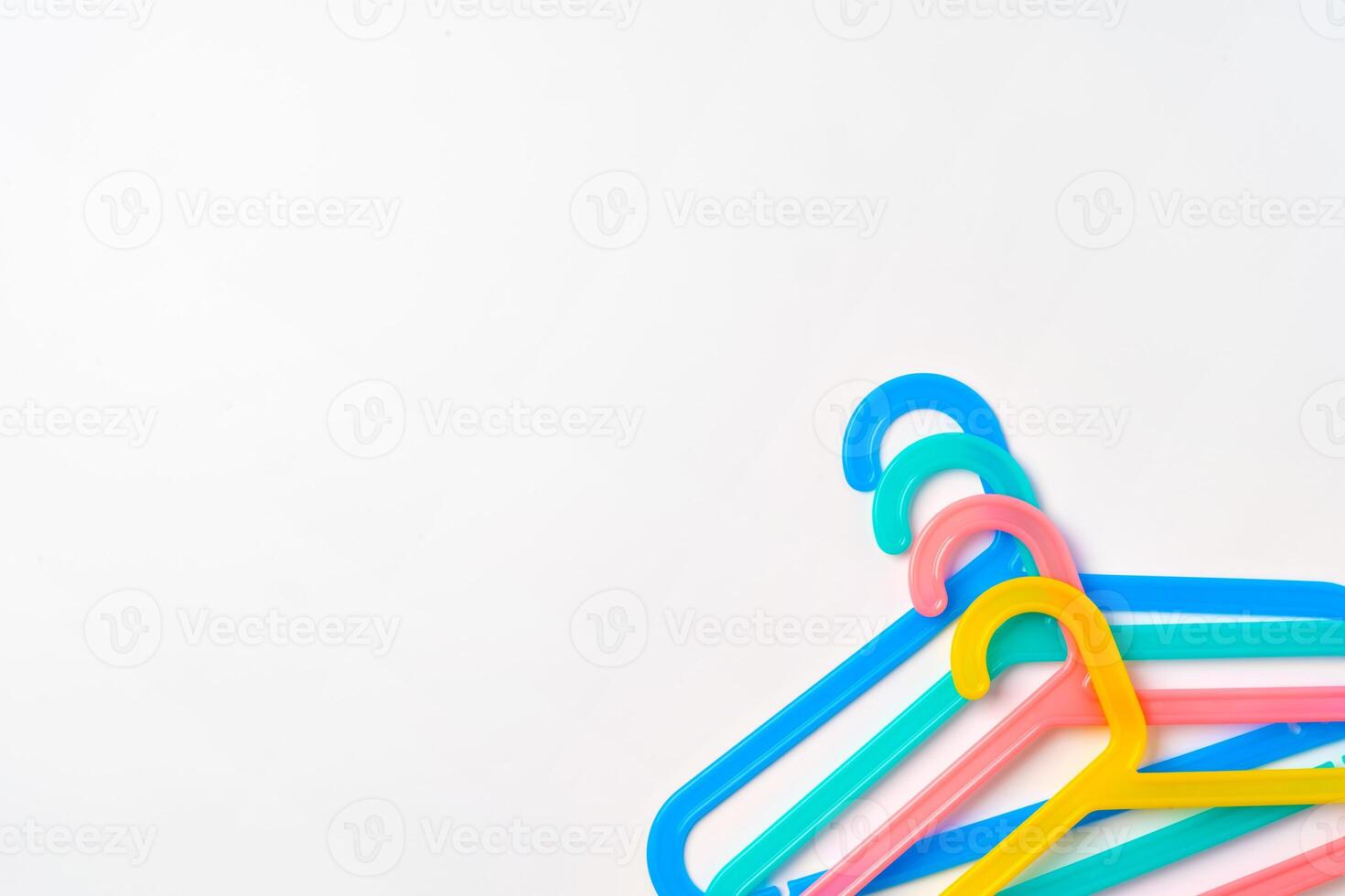 a pile clothes hangers on isolated white background photo