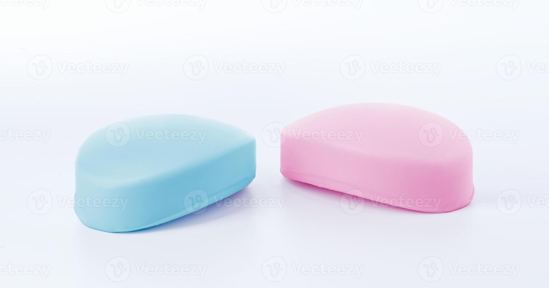 Pink and blue soap bars on white background photo