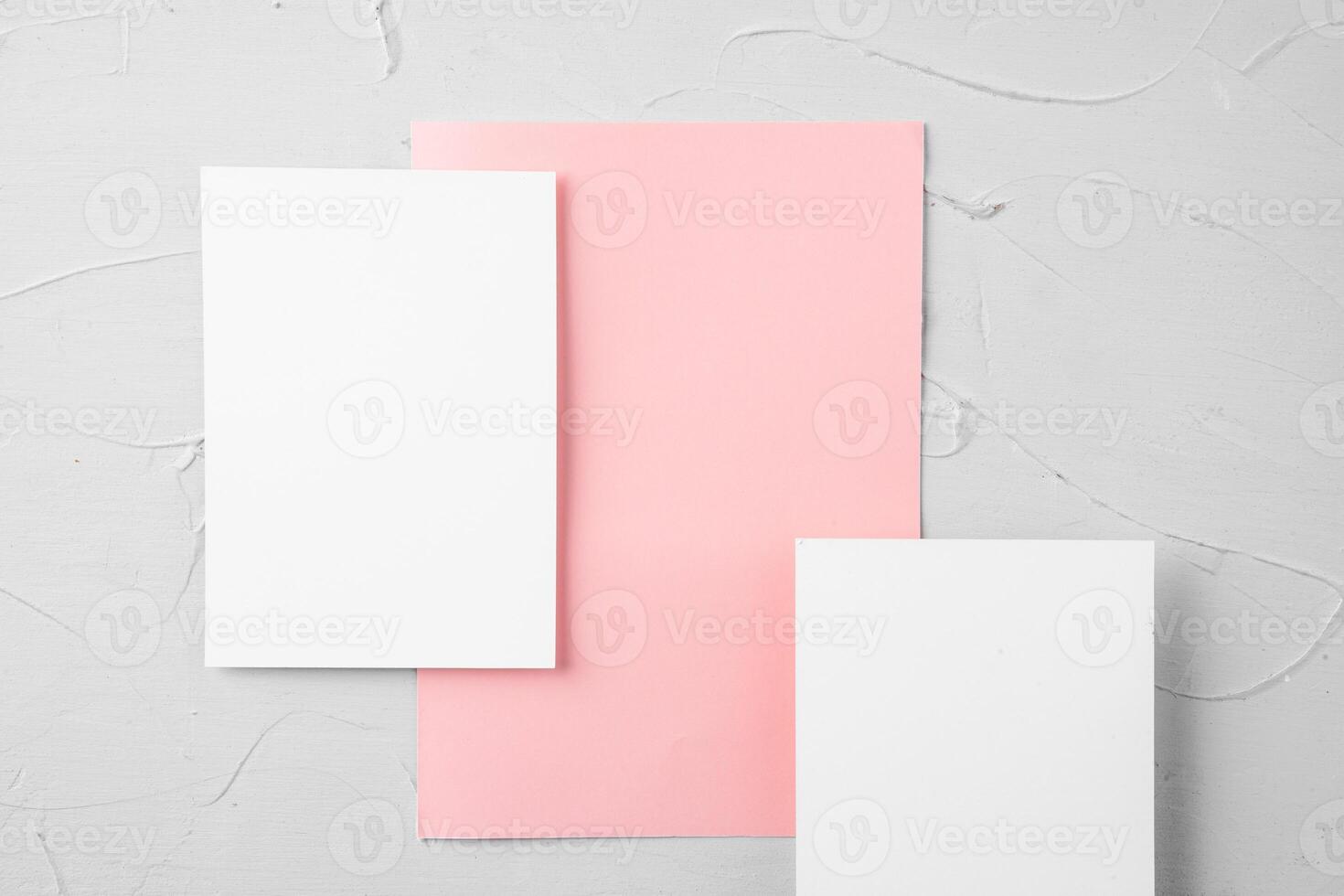 Three pieces of blank paper on grey background, top view, copy space photo