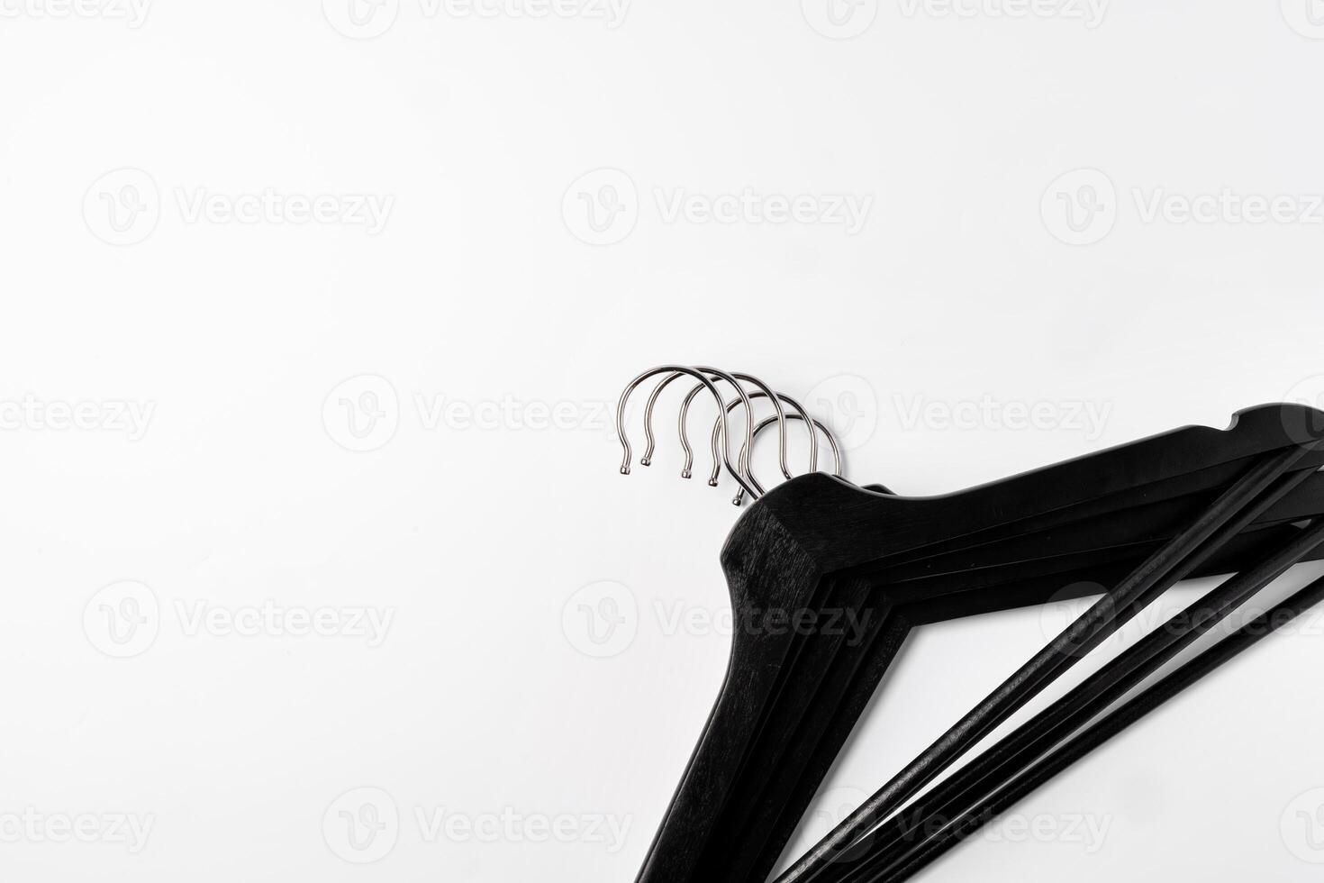 a pile clothes hangers on isolated white background photo
