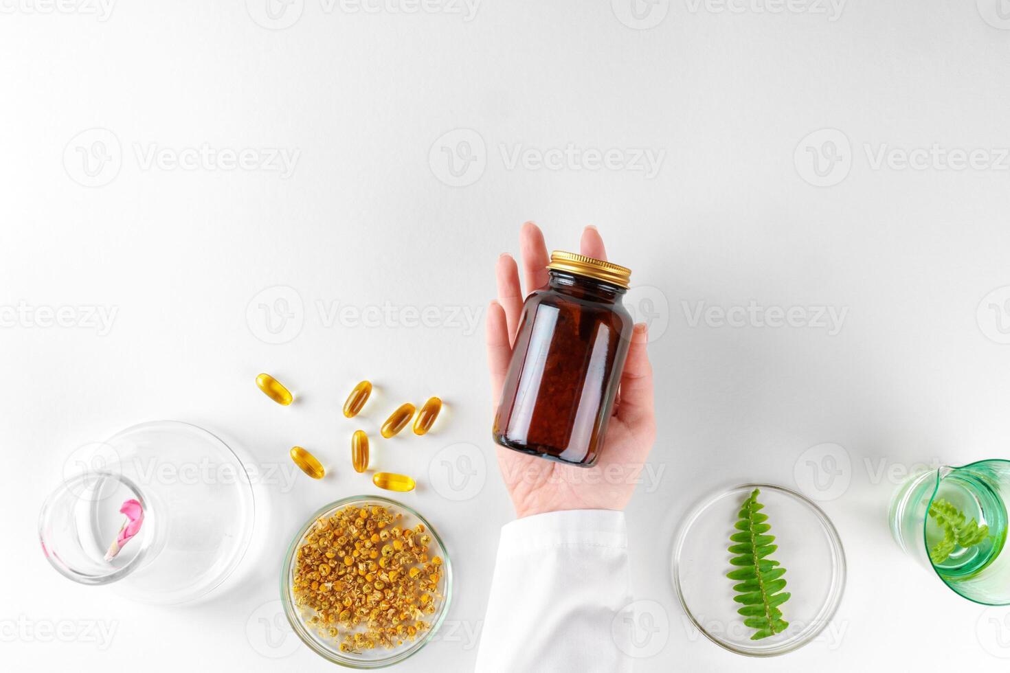 Making herbal dietary supplement in lab with plant leaves. Health and beauty concept photo