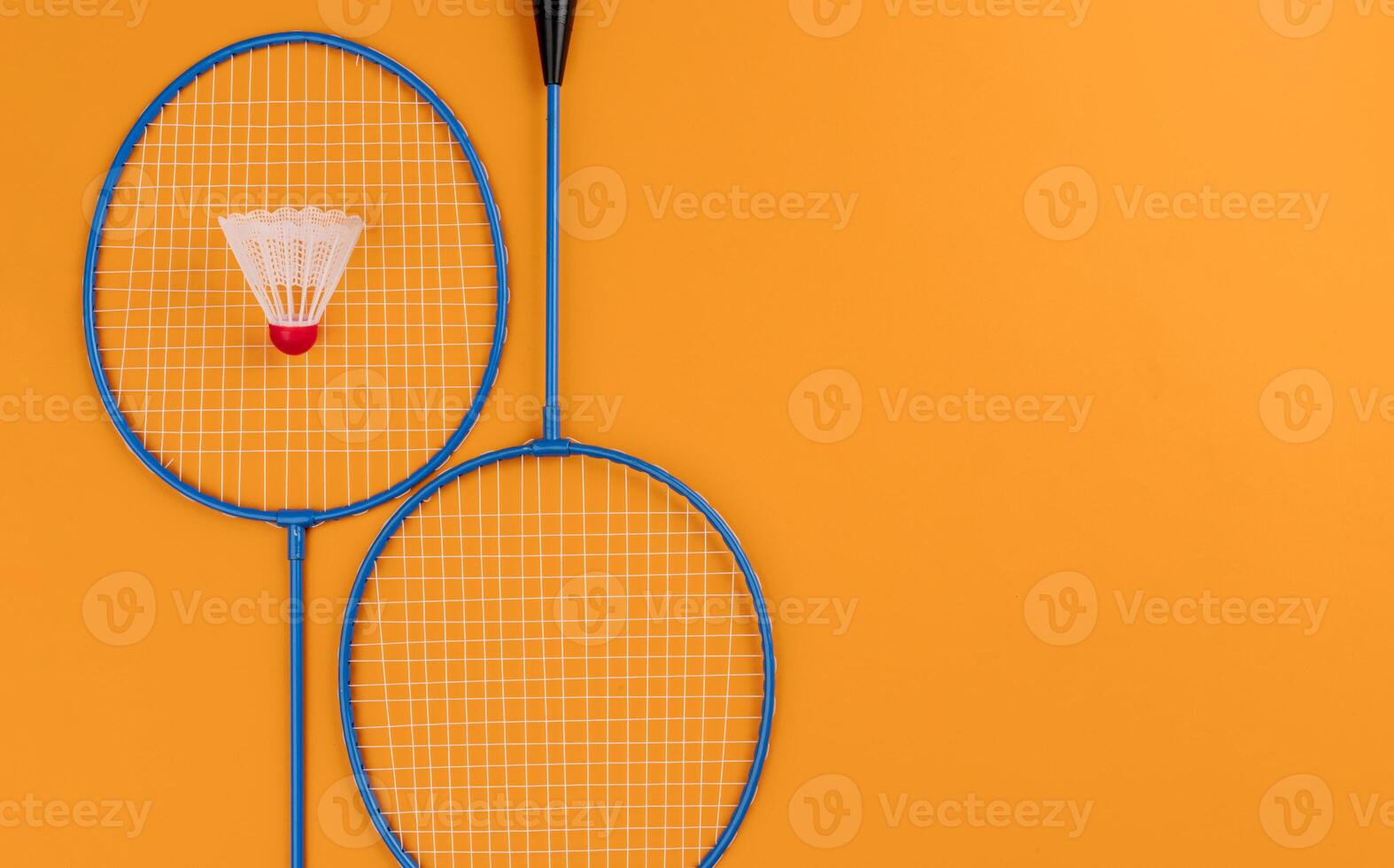 Set of shuttlecock and two badminton rackets photo