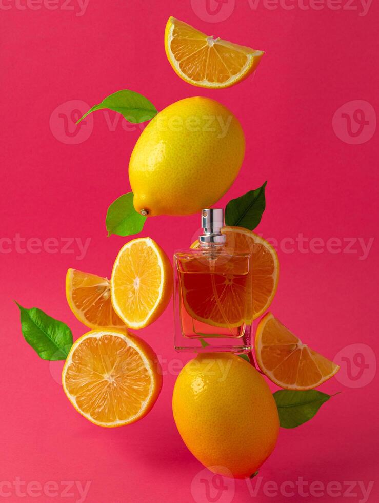 Beautiful composition with bottle of perfume and citrus fruits photo