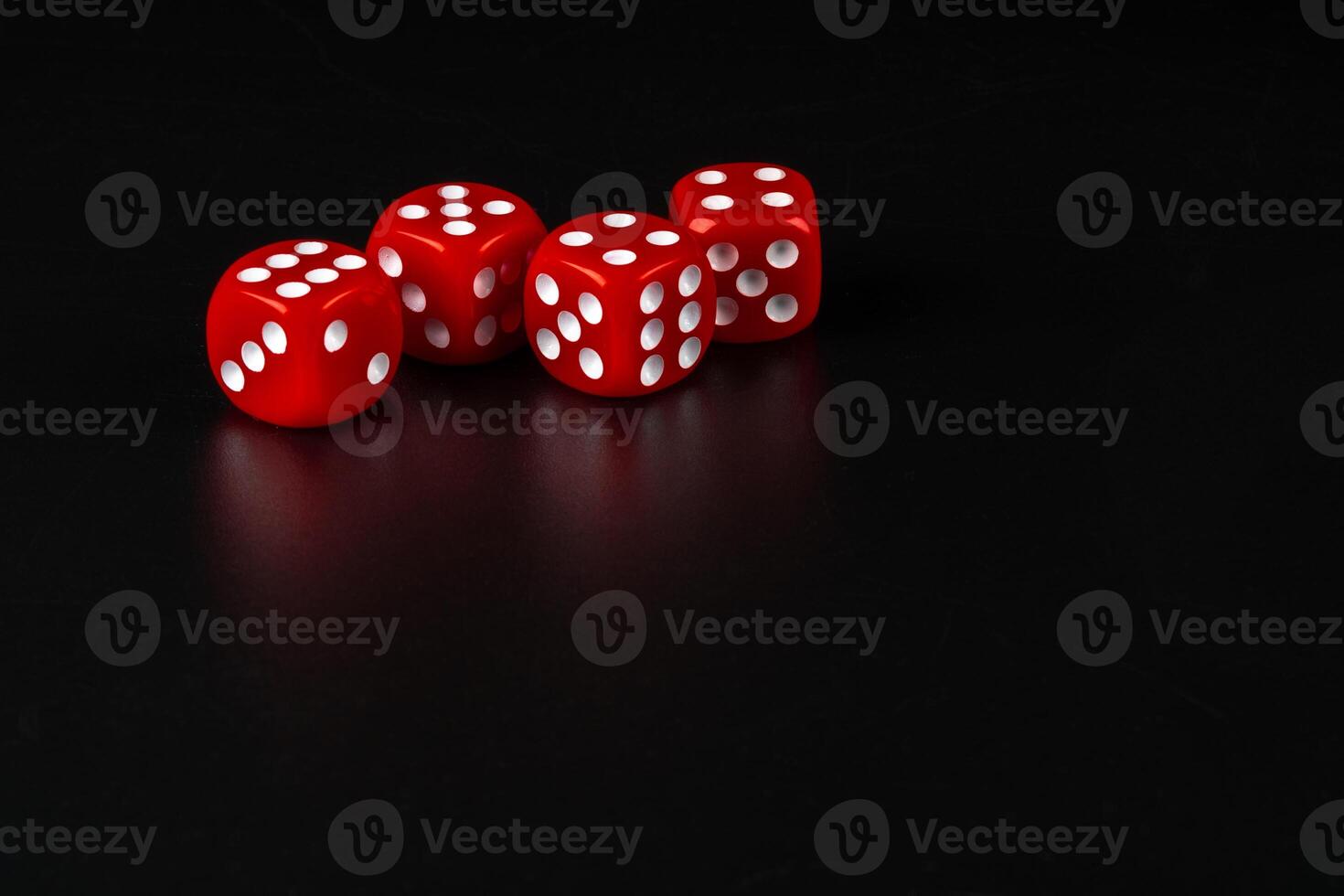 Group of dice close up on dark black background photo