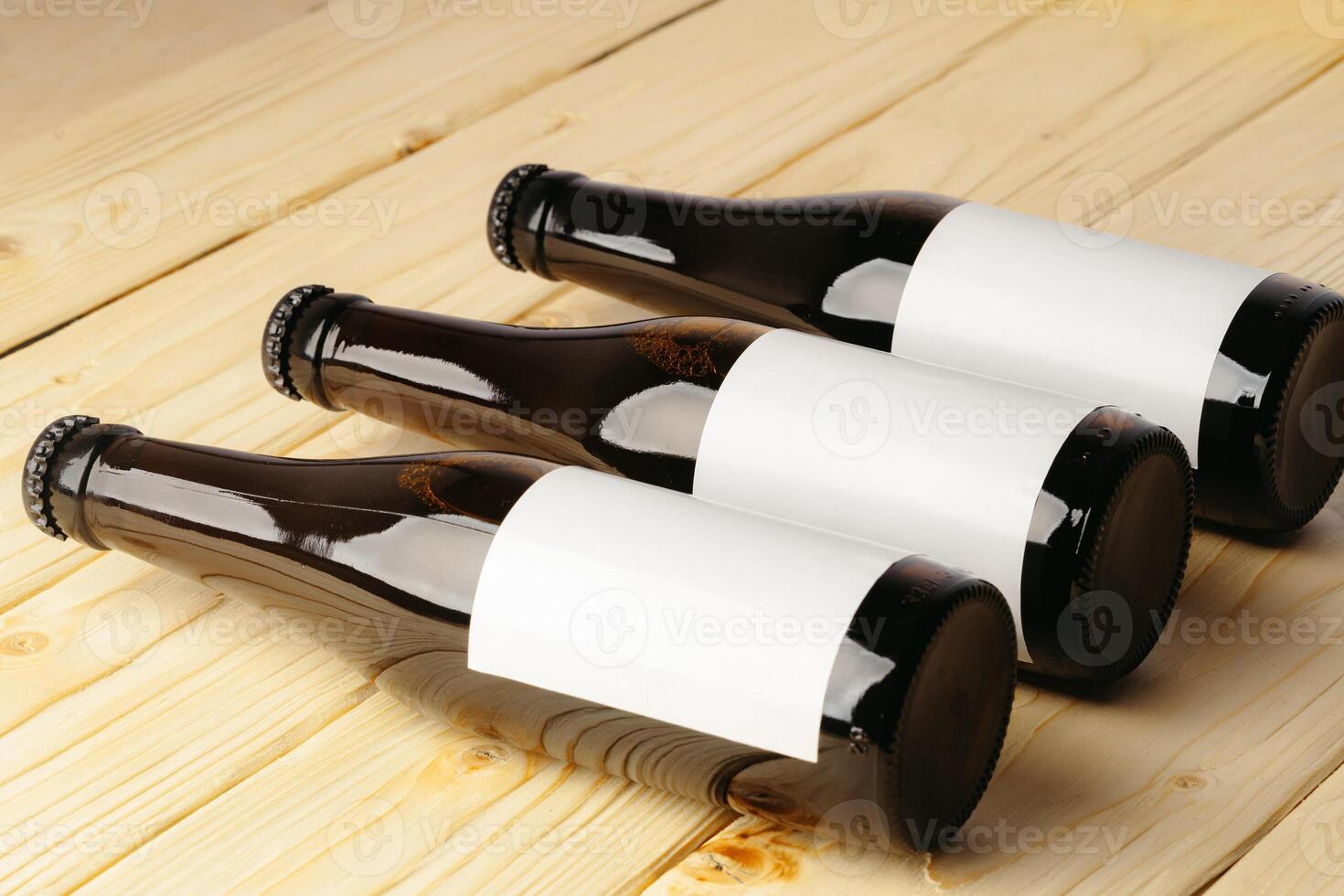 Beer bottle on a brown wooden table flat lay background with a copy space photo