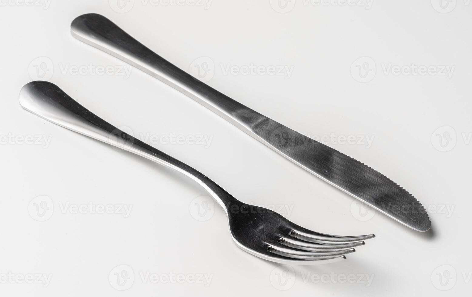 Fork and knife isolated on white background photo