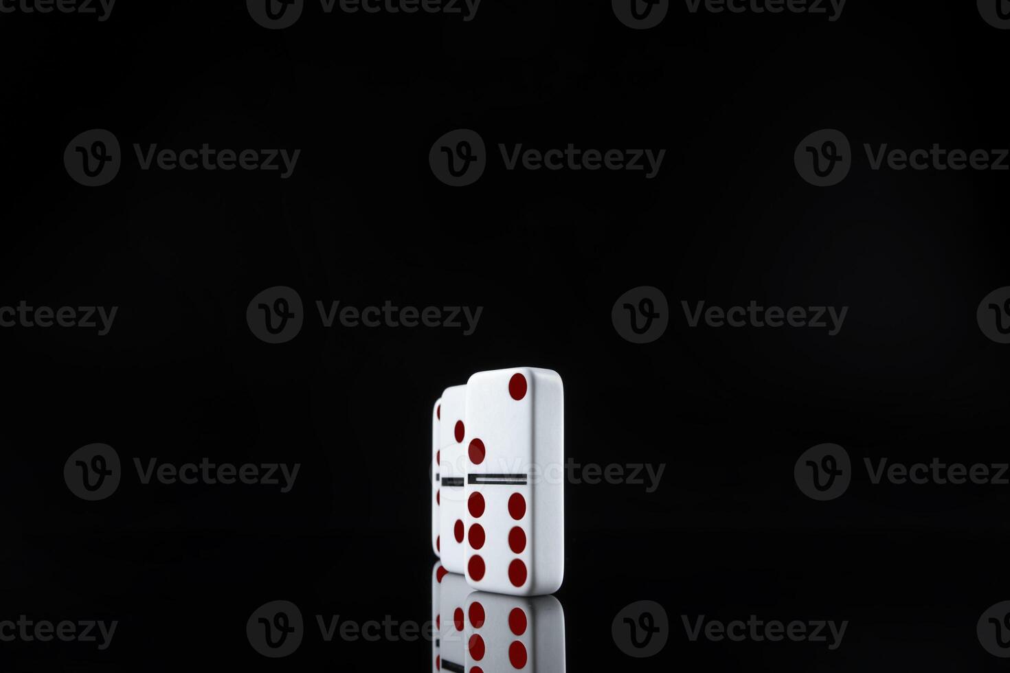 Domino game. Dominoes on a black table photo