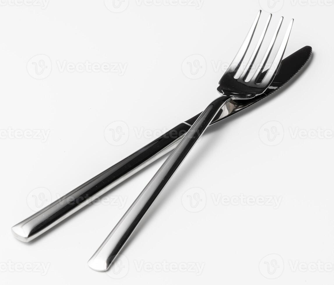 Fork and knife isolated on white background photo