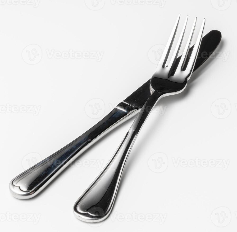 Fork and knife isolated on white background photo