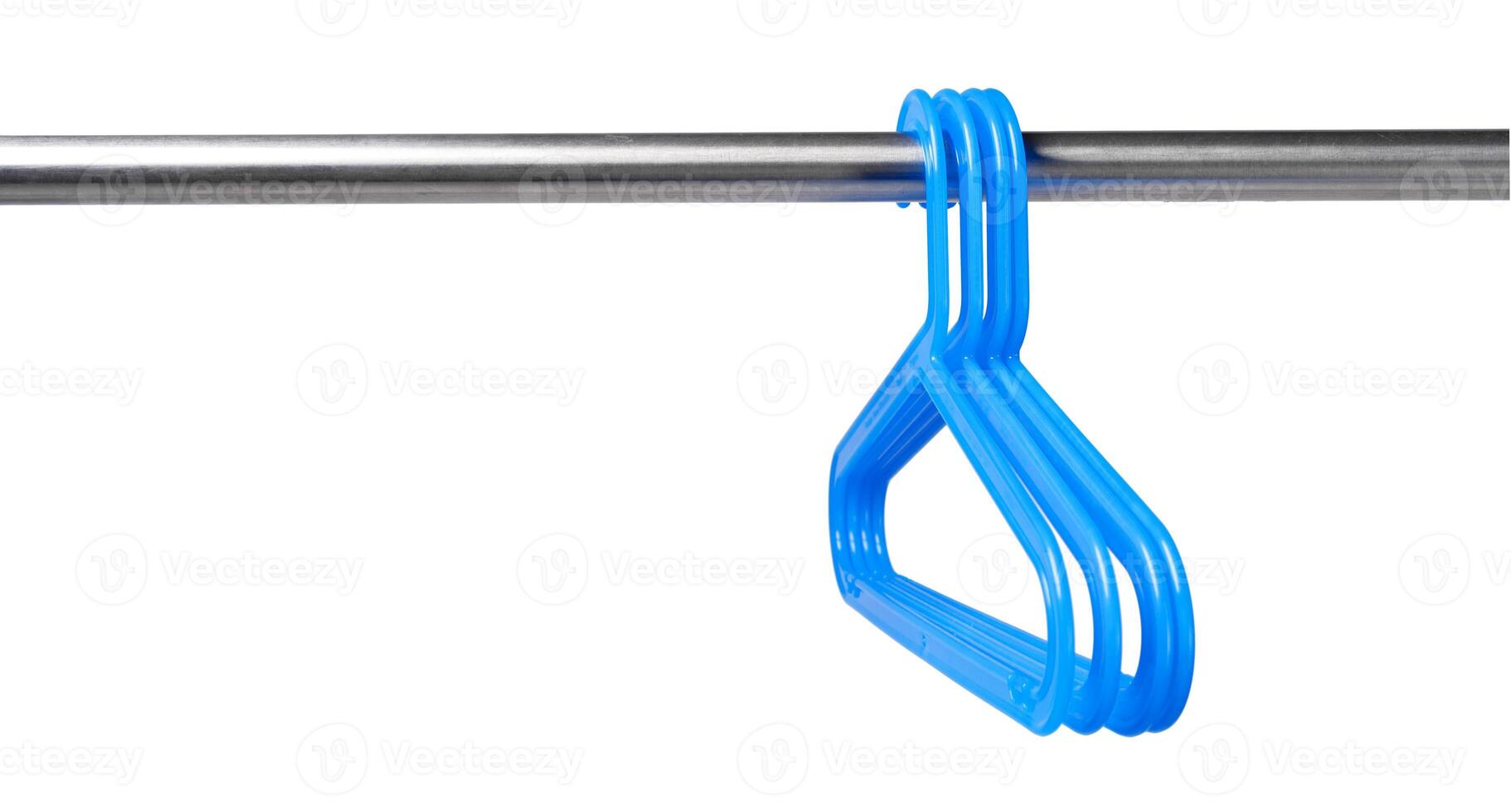 Metal rack with clothes hangers on white background photo