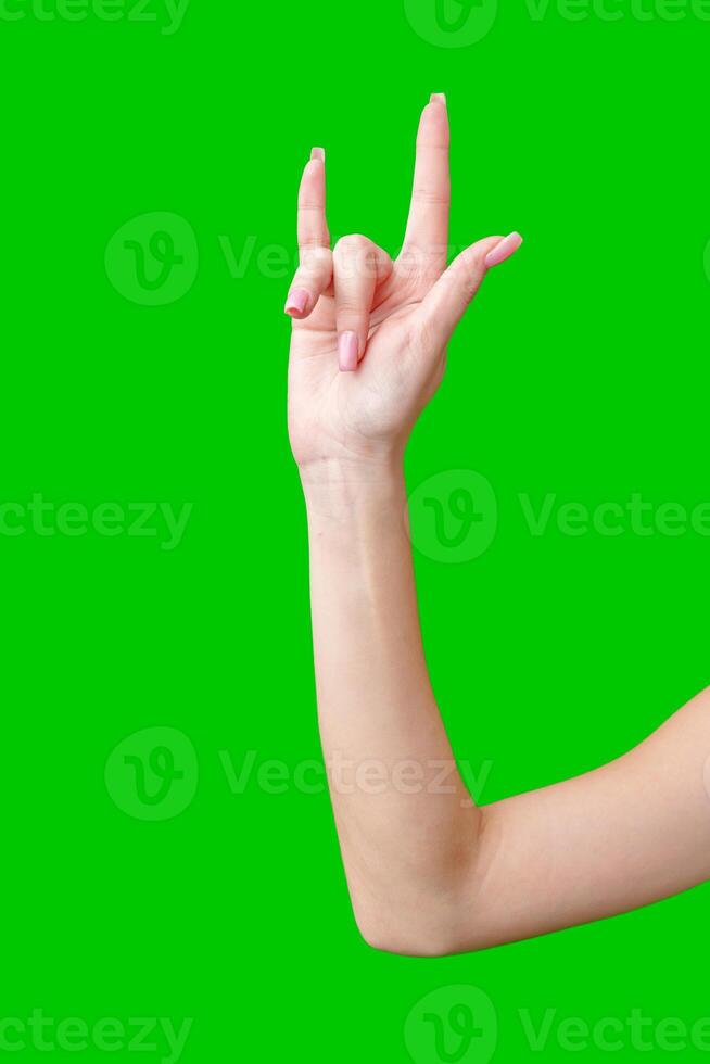 Female Hand Making Gesture Against Green Screen photo
