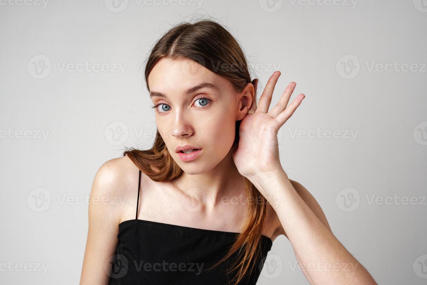 Young Woman Listening Attentively to a Conversation photo