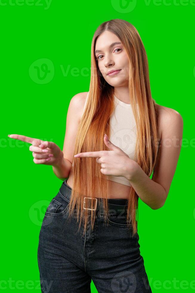 Young Woman With Long Hair Pointing To Copy Space photo