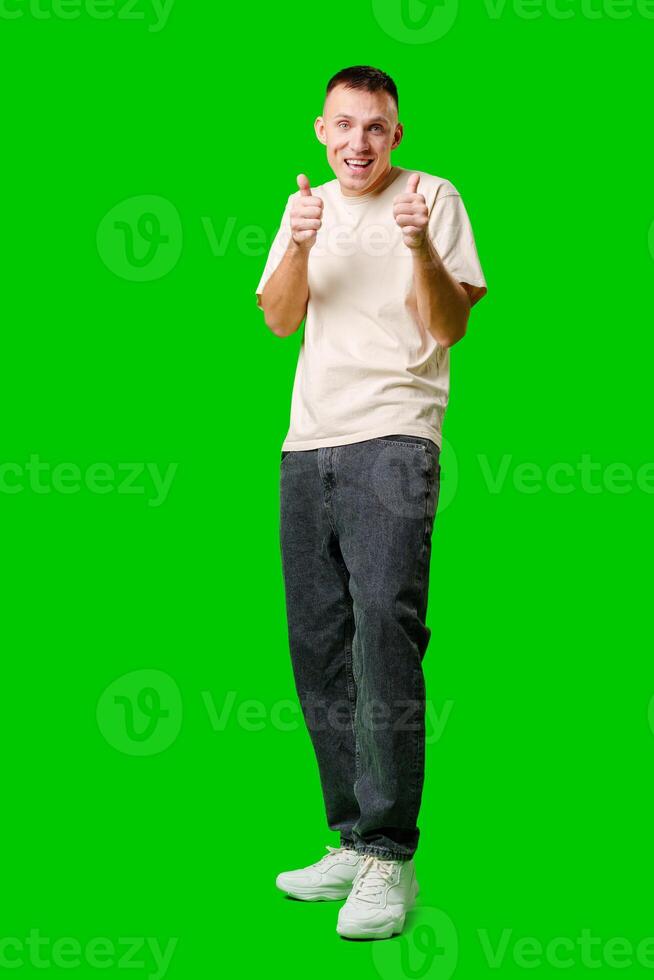 Man Smiling and Making Okay Gesture Against Bright Green Background photo