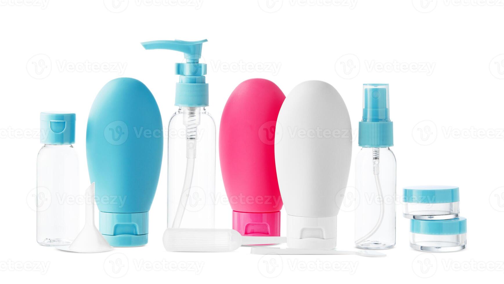 Clear plastic bottles with blue pumps and spray tops arranged on a white background photo