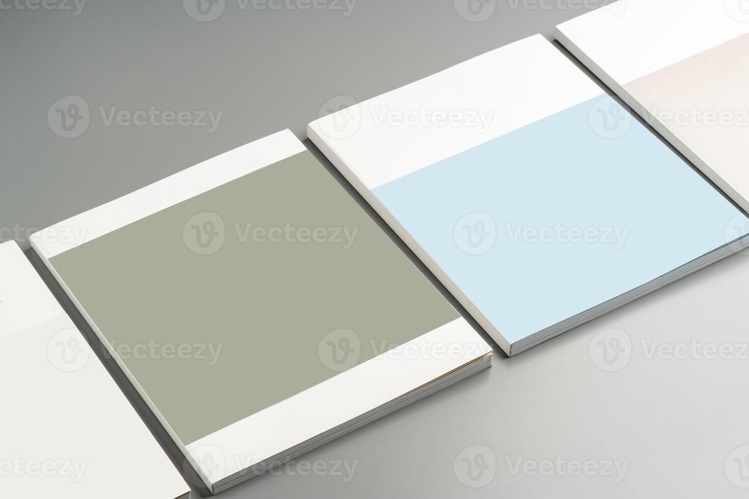 Various color swatches neatly arranged on a gray surface showcasing different shades and finishes in natural light photo