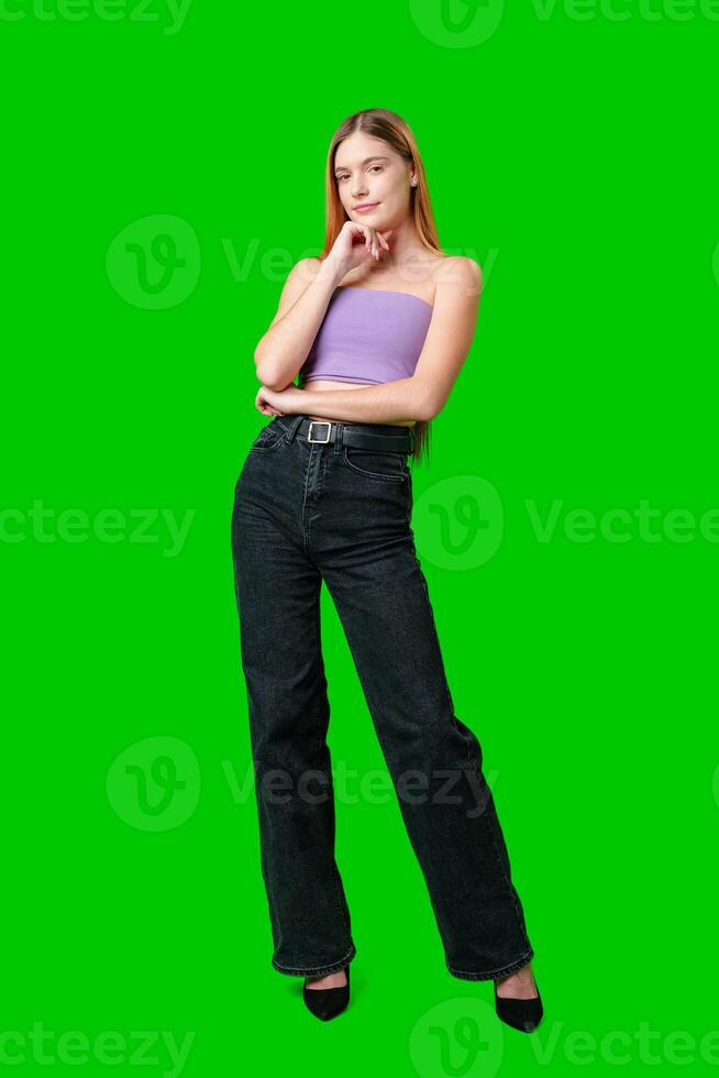 Woman With Long Hair Contemplating While Posing Against a Green Screen photo
