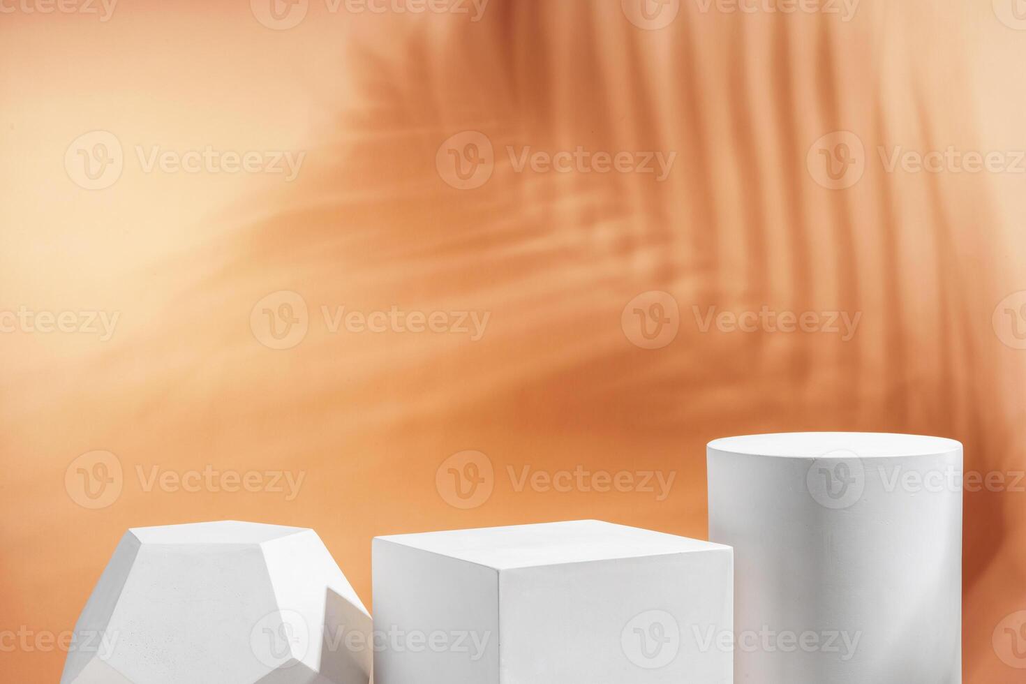 White geometric shapes arranged stylishly on a soft peach background in a minimalist setting photo