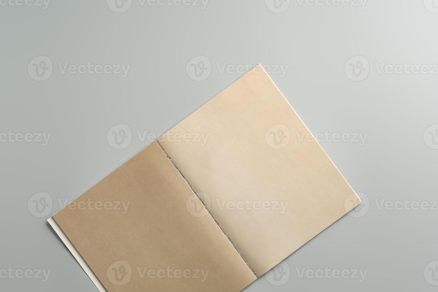 Open Blank Notebook on Minimalist Desk Surface in Soft Natural Light During Daytime photo