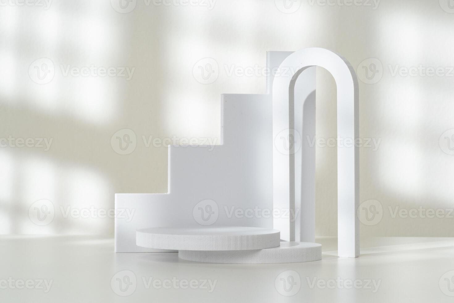 Modern Minimalist White Sculpture Displayed on Soft Draped Fabric in Natural Light photo