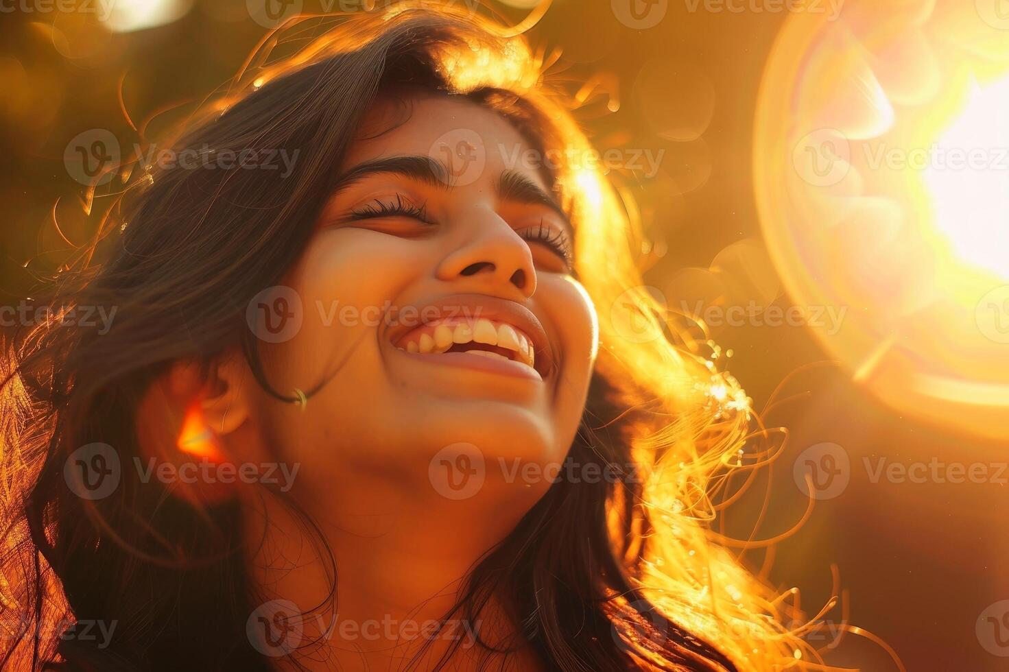 A South Asian woman laughing with her eyes closed, sunlight filtering through her hair and casting a warm glow on her face. AI generate photo