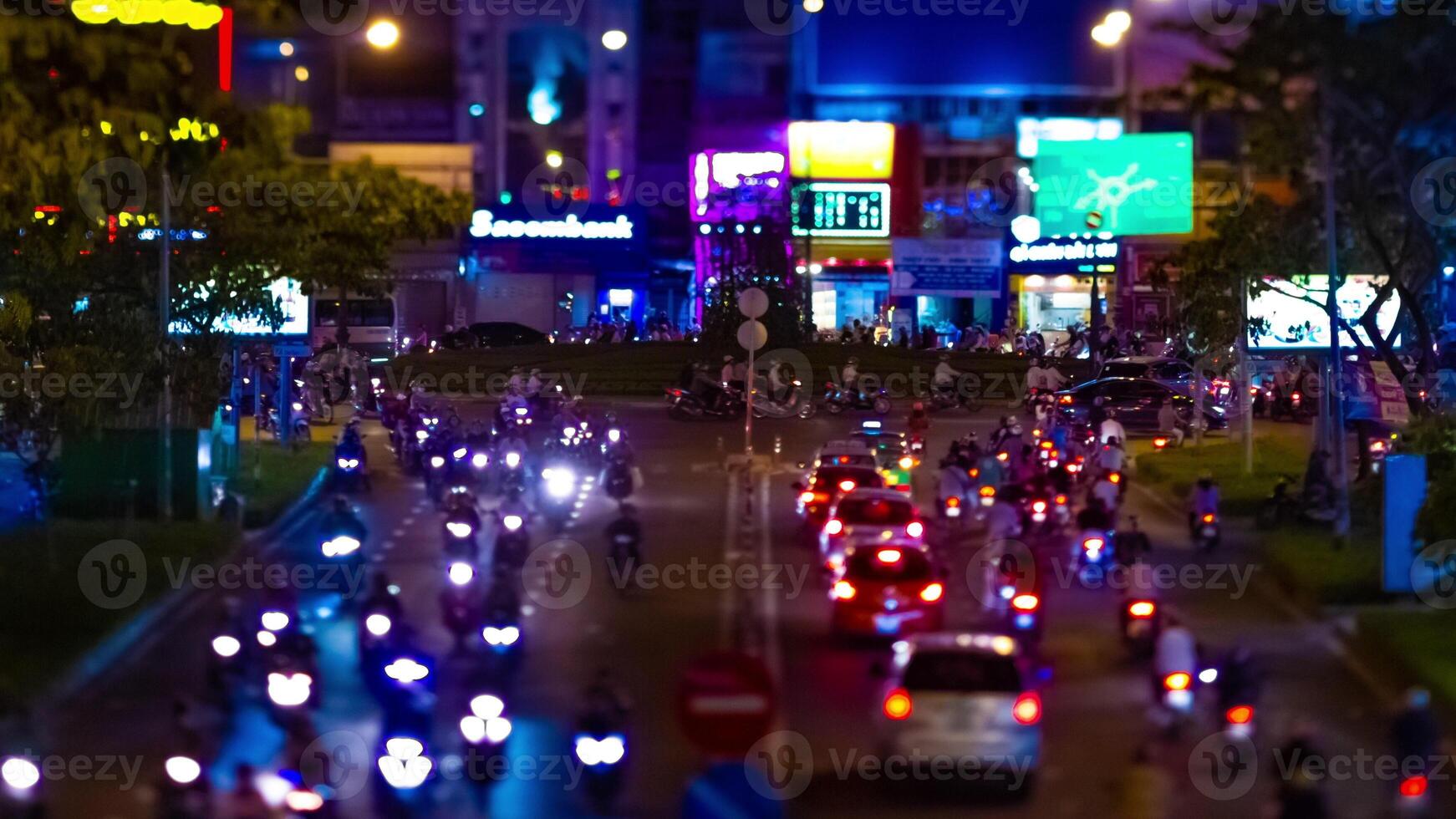 A night timelapse of the miniature neon street at the downtown in Ho Chi Minh Vietnam tiltshift zoom photo