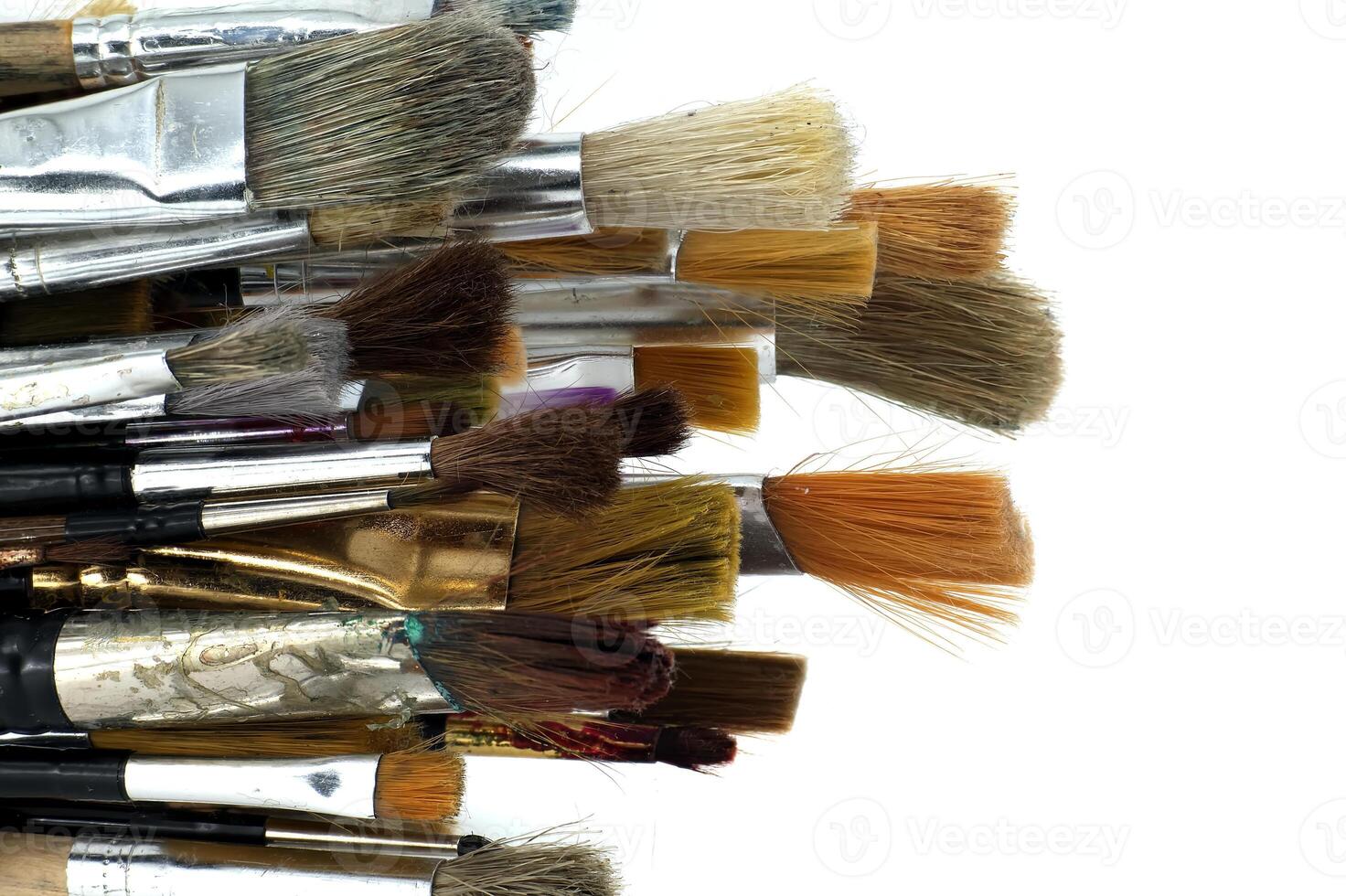 Assortment of various types and sizes of paintbrushes photo