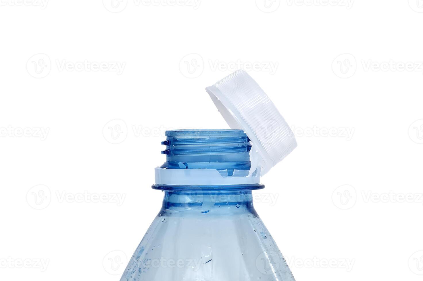 Close-up of an open blue plastic water bottle with a white cap against a white background photo