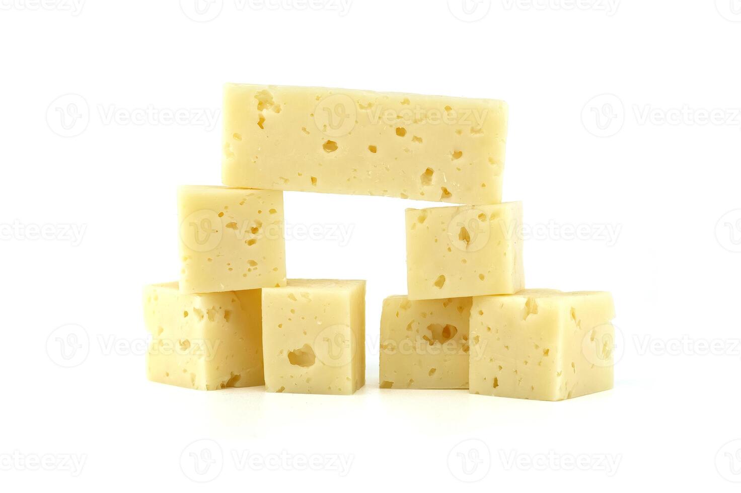 Stack of Swiss cheese cubes isolated on white background photo