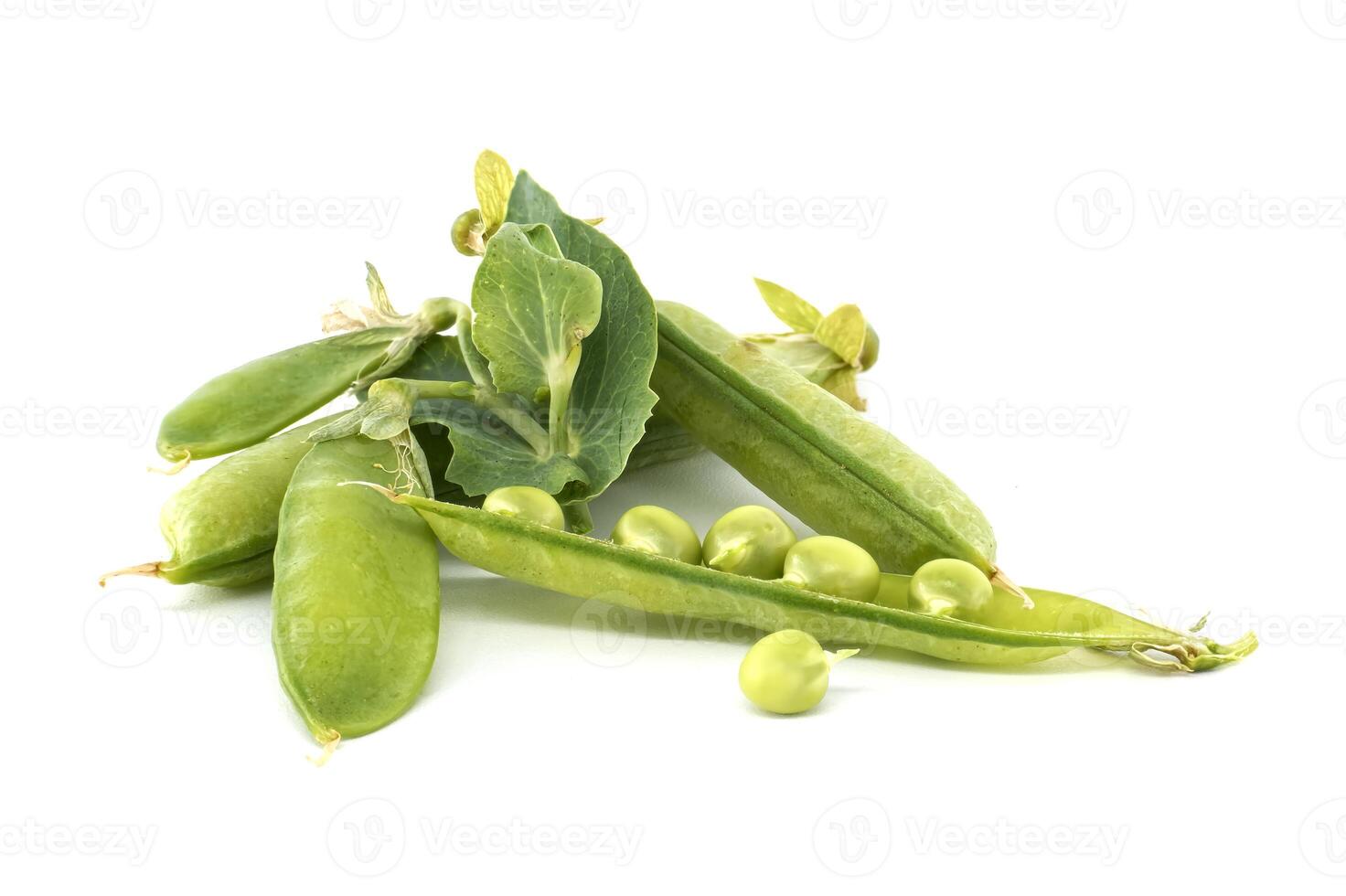 Fresh green peas in and out of pods isolated on white background photo