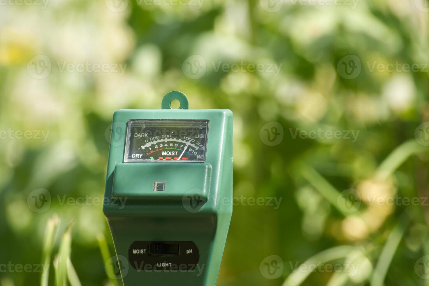 Three way meter PH, light and moisture in the soil photo
