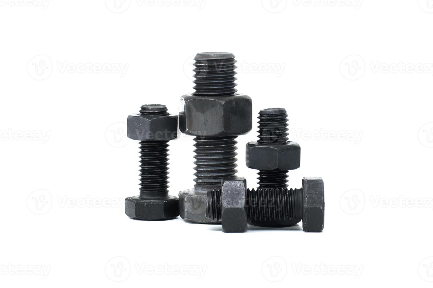 Closeup of assorted metal bolts and nuts isolated on a white background photo