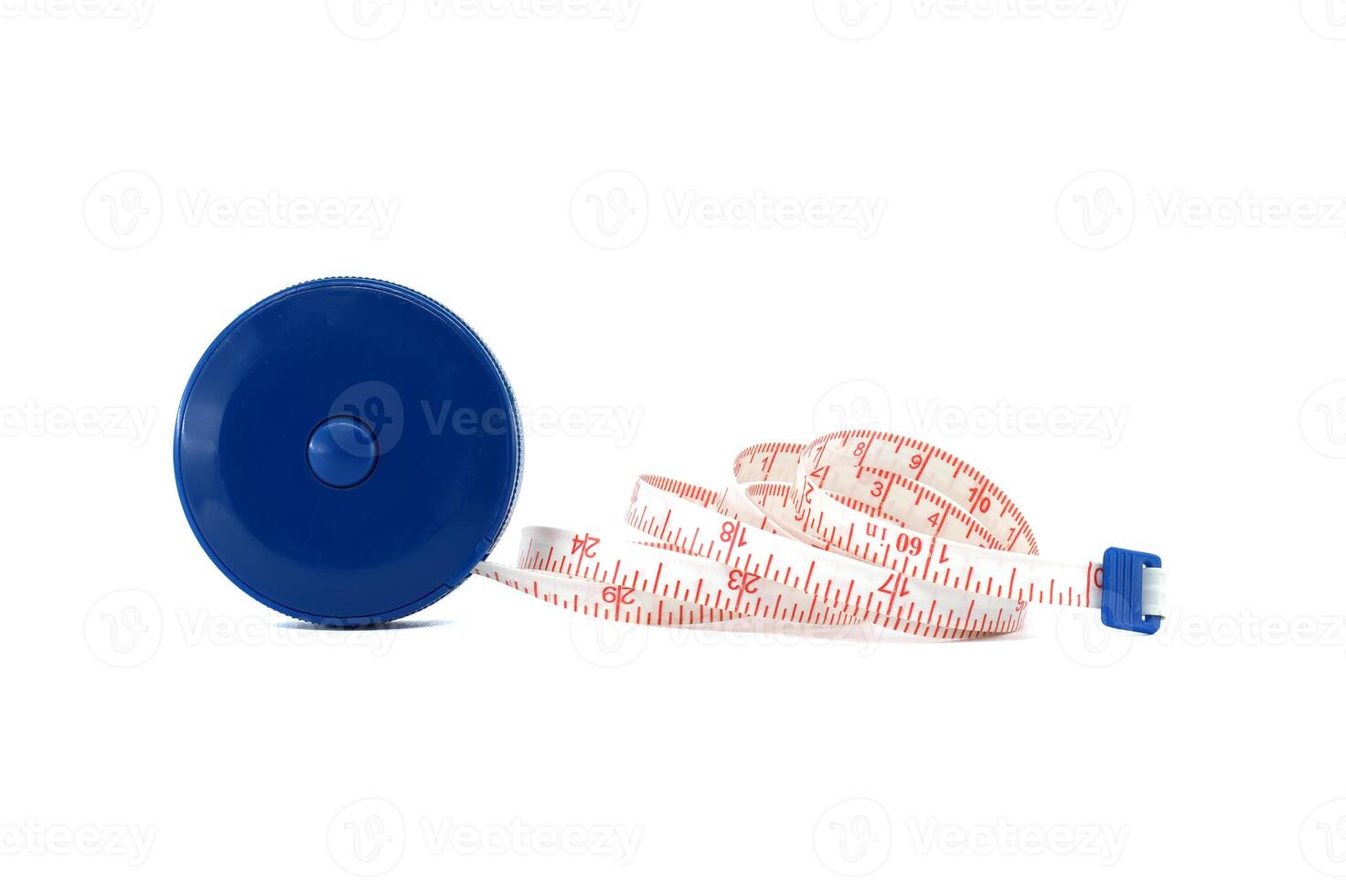 Coiled measuring tape with blue plastic case on white background, precision and measurement tools photo