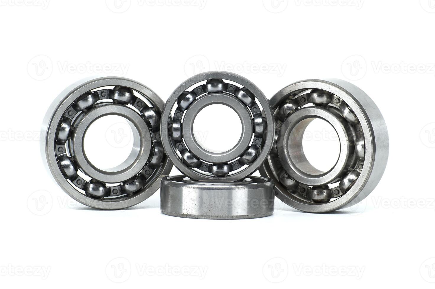 Set of metal ball bearings in various sizes isolated on a white background photo