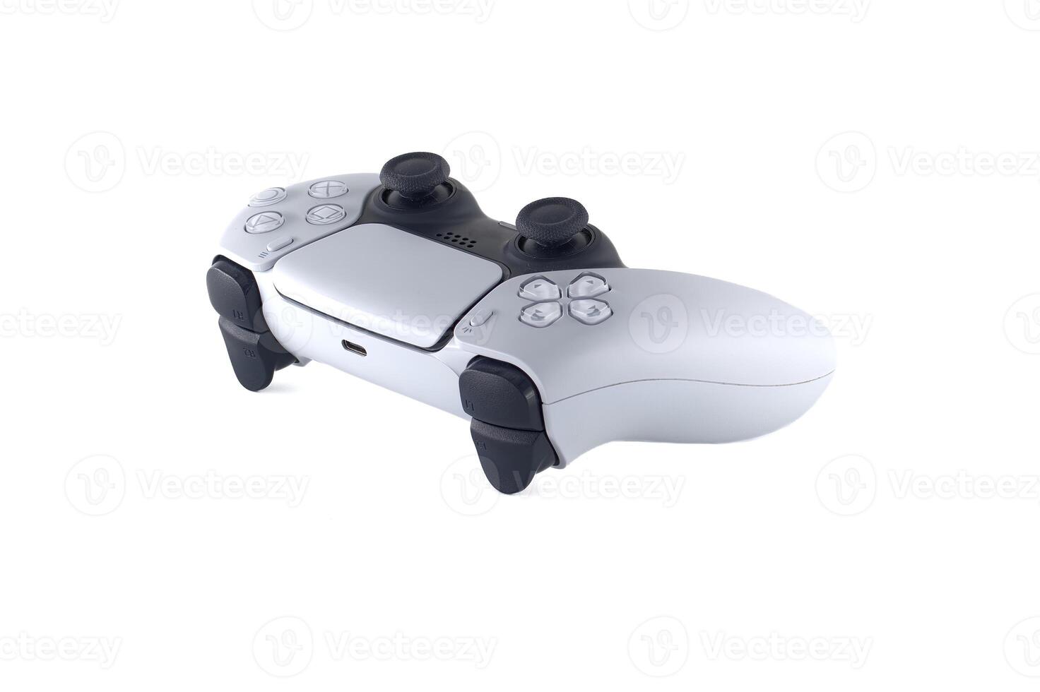 Close-up of a modern gaming controller with sleek white design and ergonomic features photo