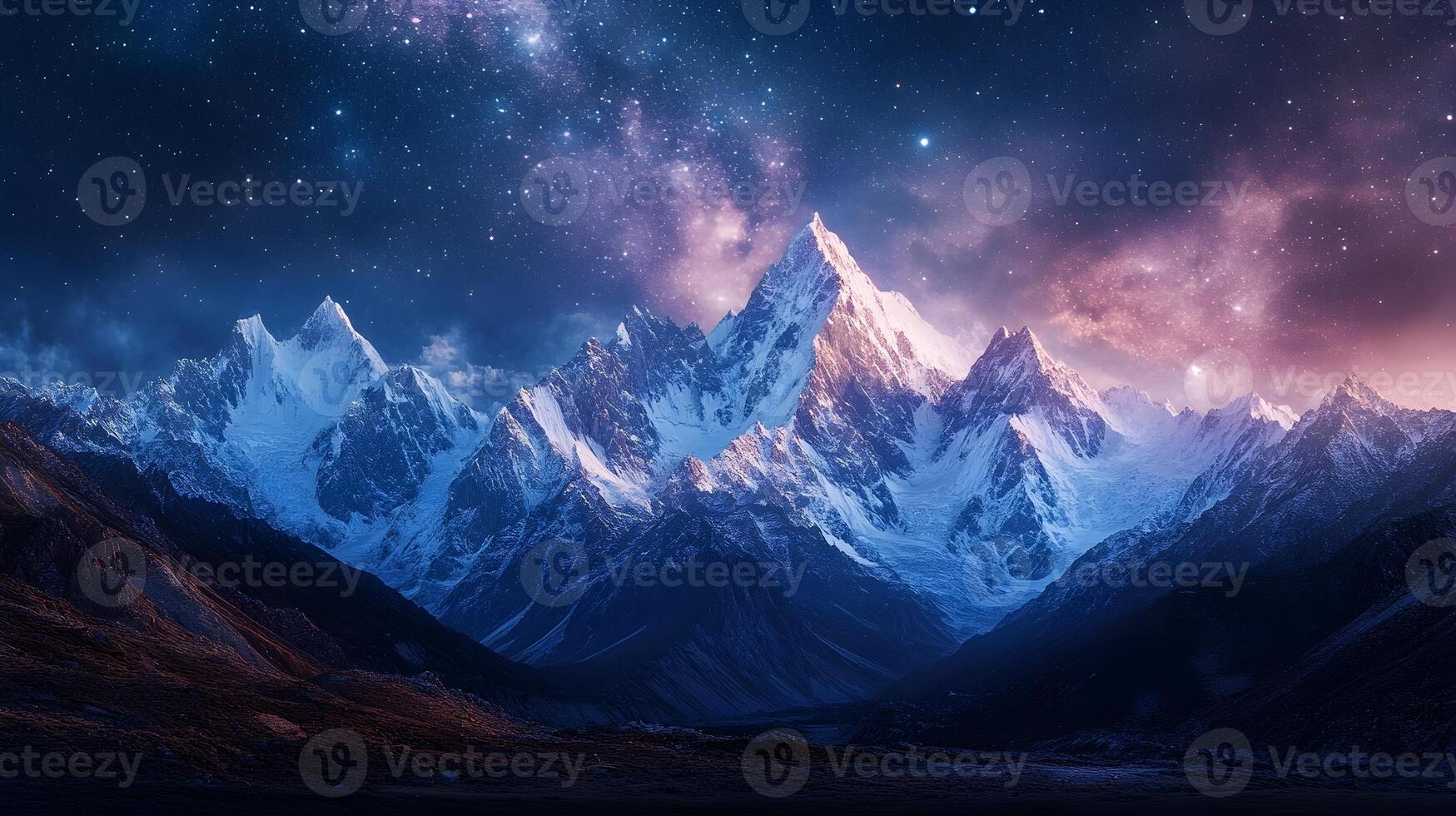 Mesmerizing Snowy Mountain Range Under Starry Night Sky photo