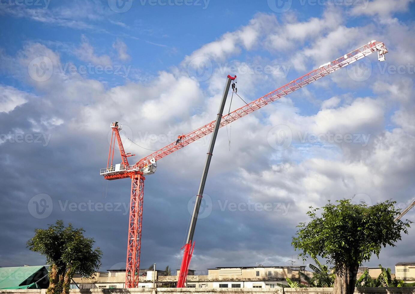 Worker On the tower crane is assembling the crane. photo