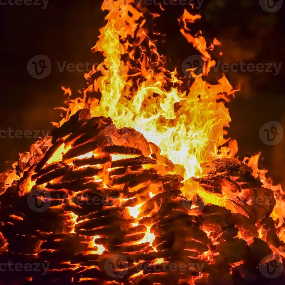 Fire flames on black background, Blaze fire flame texture background, Beautifully, the fire is burning, Fire flames with wood and cow dung bonfire photo