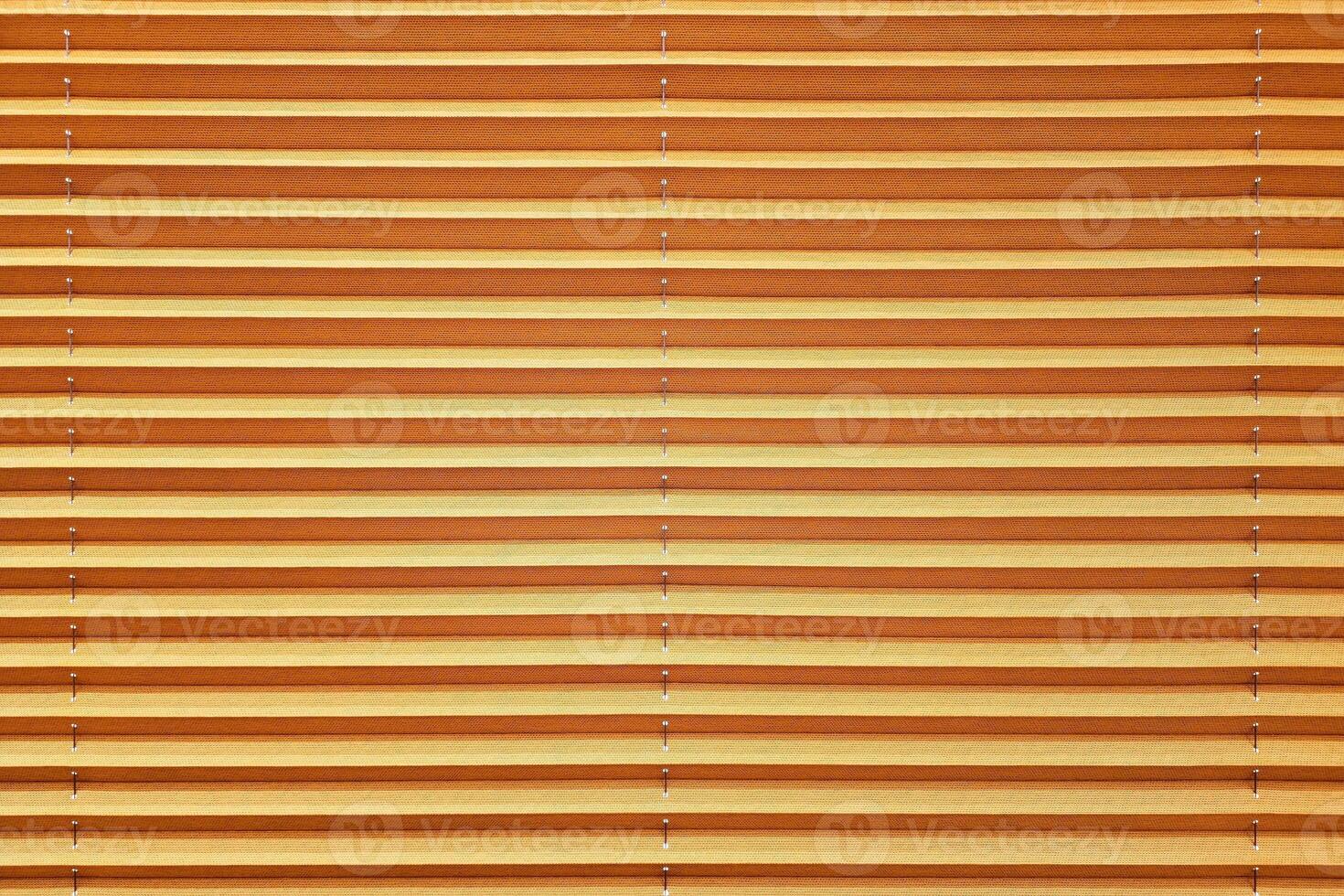 Close up Orange Window Blind Background. photo