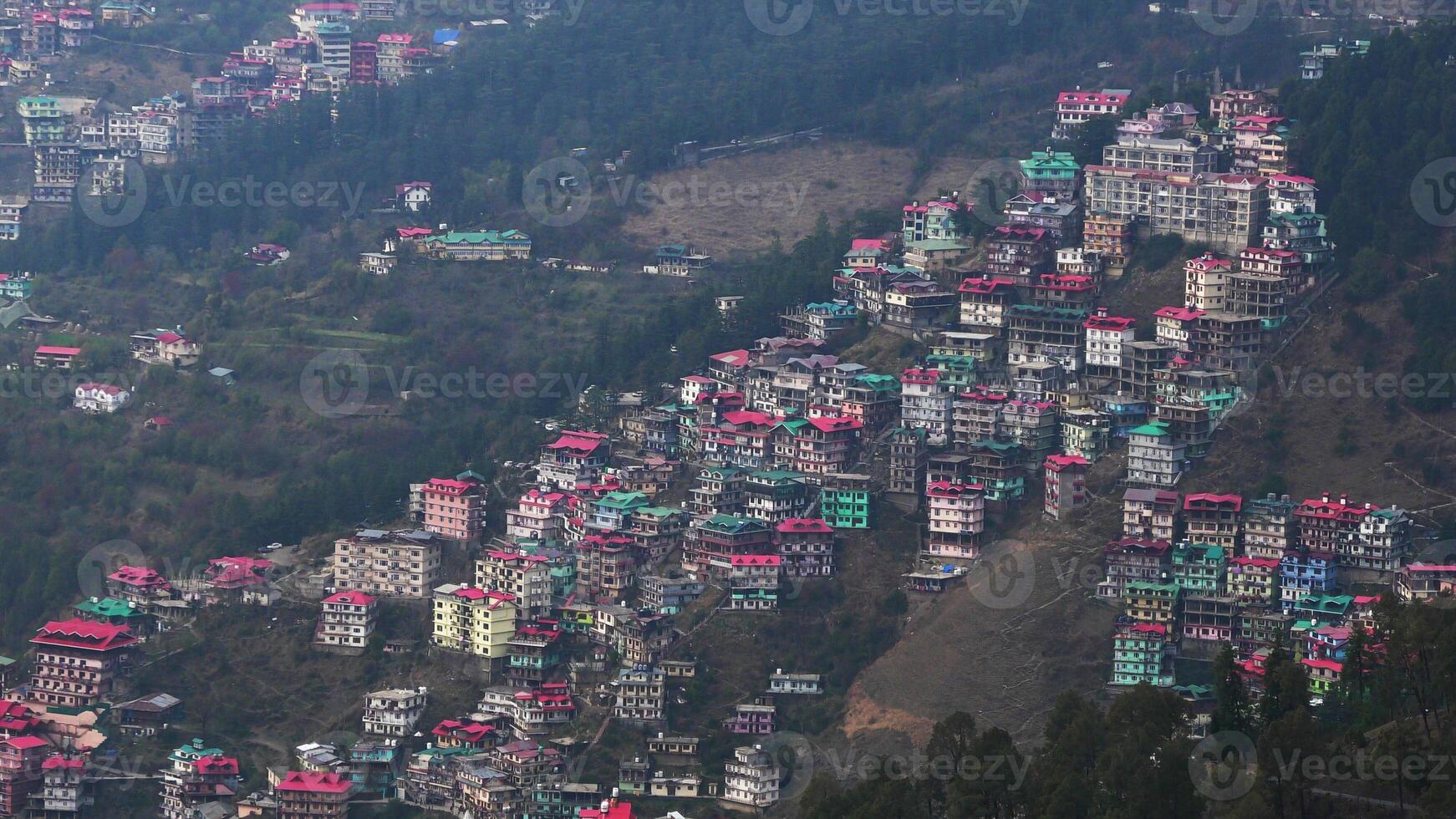 A hilly landscape full of residential complexes in Himachal Pradesh, India photo